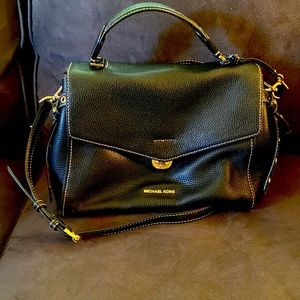 Elegant, black leather Michael Kors satchel